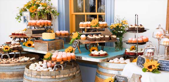 Buffet of deserts artfully arranged at Dana Adobe for wedding reception